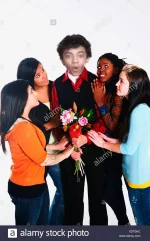 girls-surrounding-a-boy-who-is-holding-flowers-XDT0HC.png
